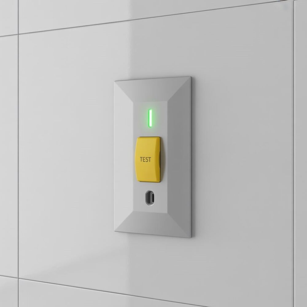 gniazdko na tle płytek łazienkowych